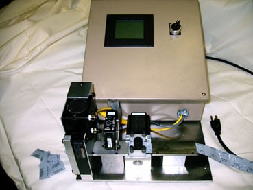 Cut to Length  Machine 
The operator uses the touch screen to set the length of the part to be cut.  
This cutter will not accumulate the length of cuts.  
There is a sensor that reads a UV dot on the part; this sets the cut.  
The cutter will cut 65 parts per minute.