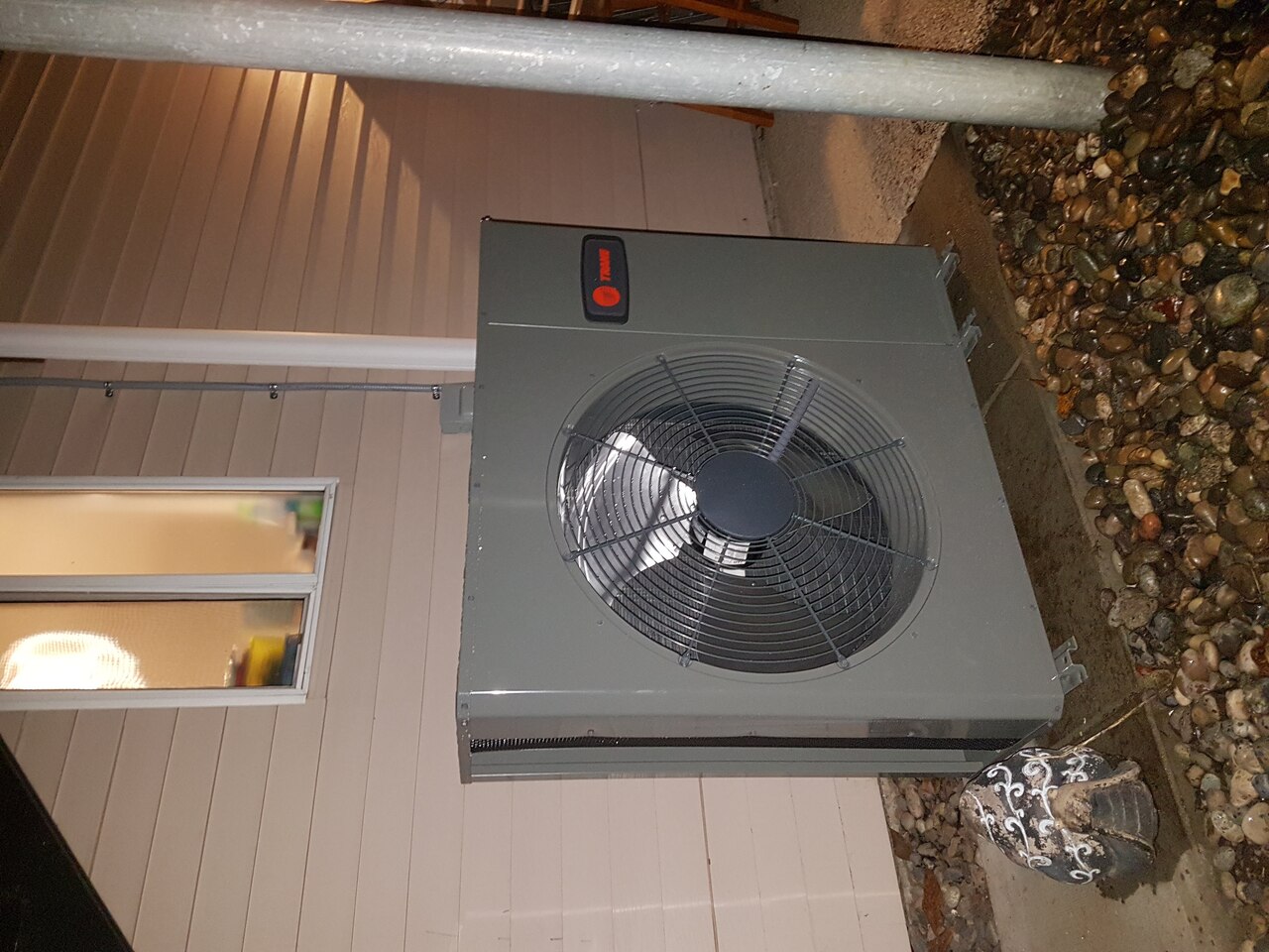 Two water bottles and kettle on counter.
Two water bottles and kettle on counter.
