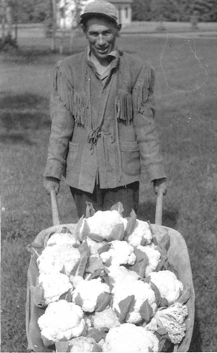 It would appear that this man is making a trip back from the garden at the experimental farm with a beautiful selection of cauliflower. He also appears to be wearing a handmade fringed hide jacket. Does anyone recognize him?
993.4.46.9 / Agriculture Canada
---Edit---
This is Bobby Mclean