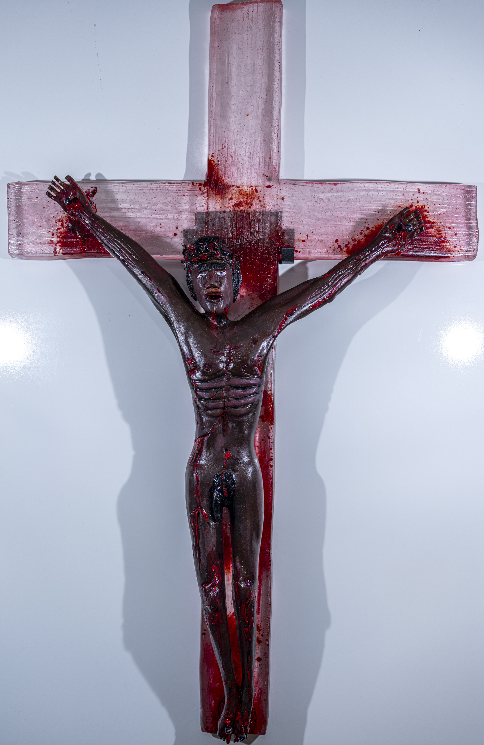 large cast glass cross with a Black Jesus carved