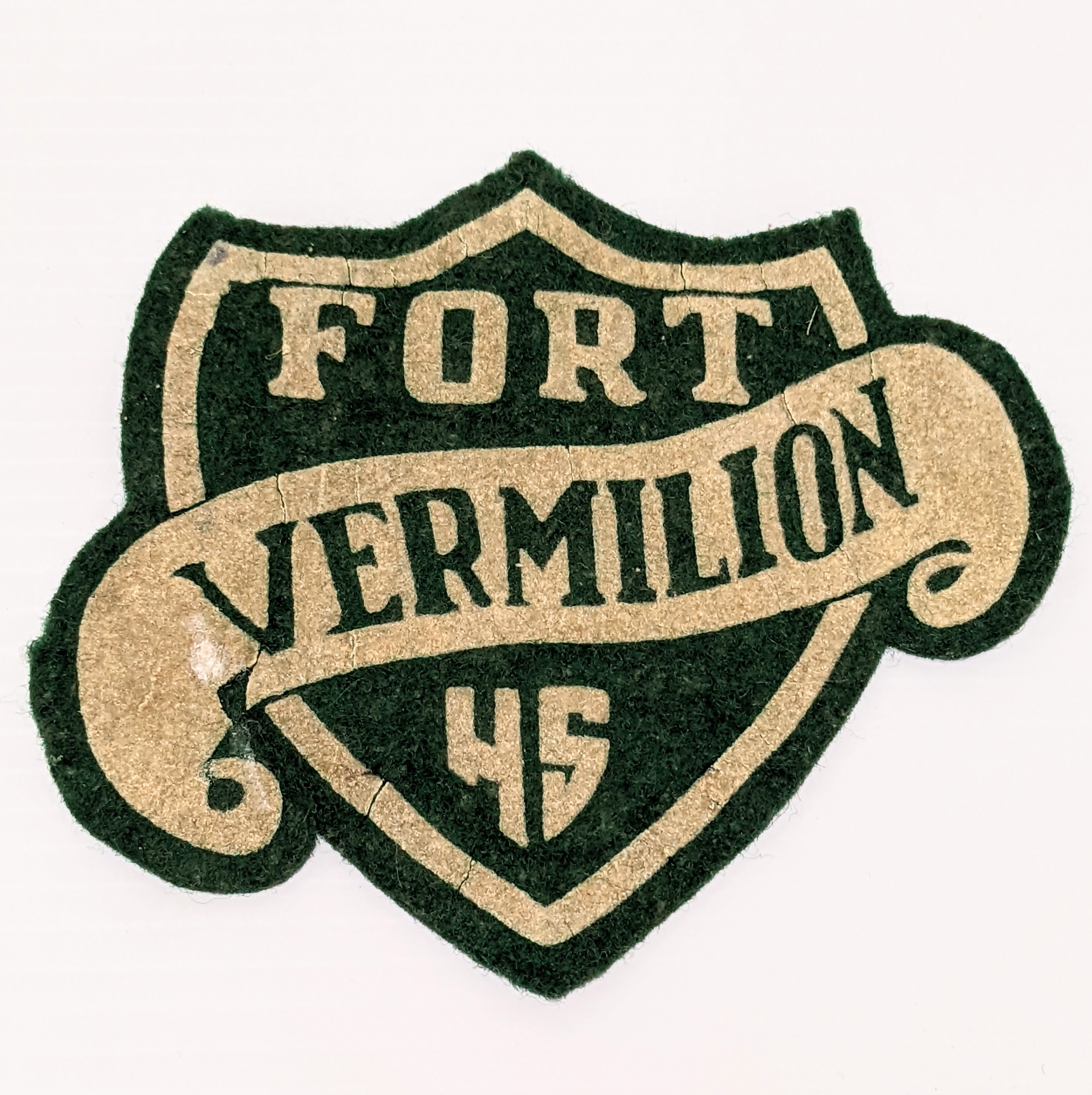 This Crest comes from the Fort Vermilion Public school in 1952! It is made of felt and would be stitched to a jacket / garment. The first public school for Fort Vermilion was established in the 30's. At this time there was also the residential school and separate school - which both belonged to the catholic school system. Though we are not sure where the original public school was located, the one previous todays modern facility was located at the top of the hill behind what is now an FVSD maintenance building.
23/05/2022
2009.70.04 / Ward, Hazel