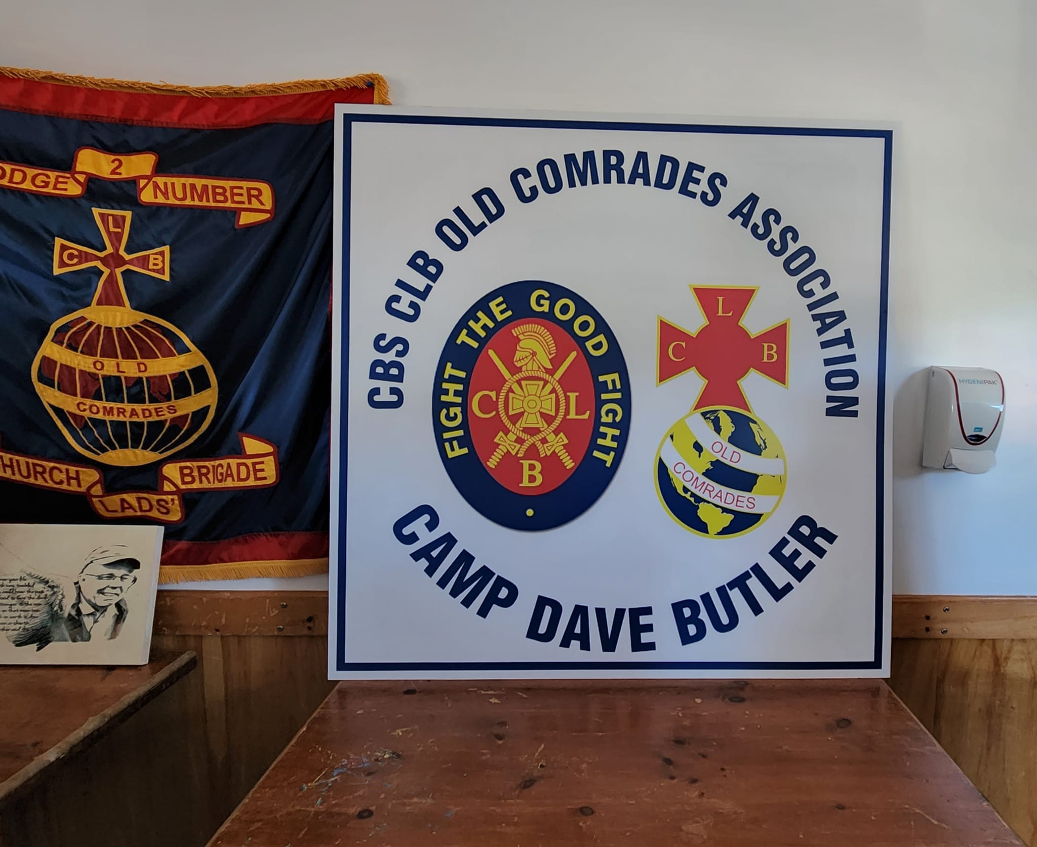 The new Camp Dave Butler building signage, along with the Old Comrades's Colours