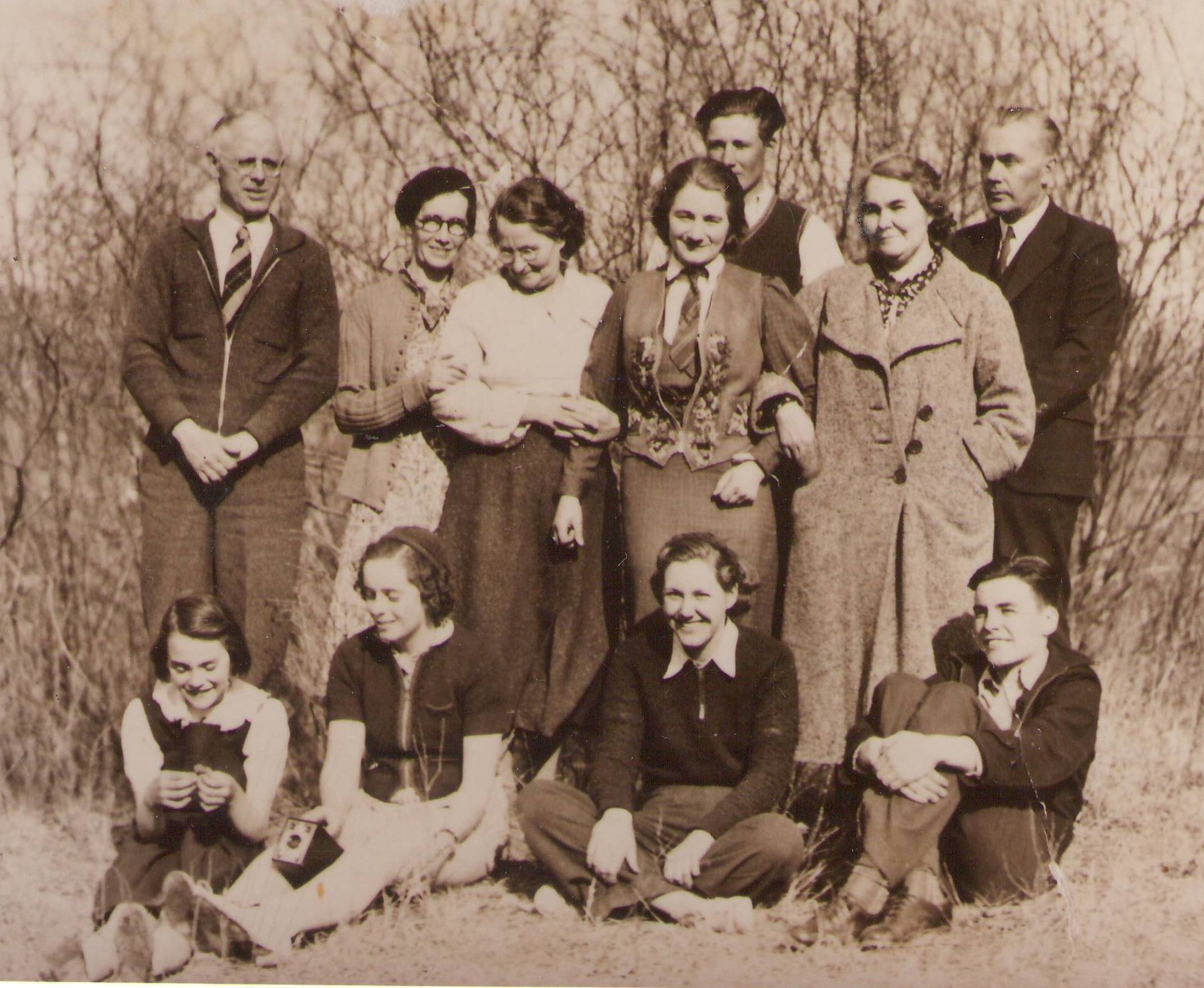 Our best guess is that this is the Boire family- but that is solely based on the fact that the young girl (front row second from left) is holding a camera identical to one we have in our collection that belonged to Rachel Boire. This also dates the images as being older then 1934 as that is when Kodak began manufacturing the camera!
990.4-81-13 / Rocky Lane School