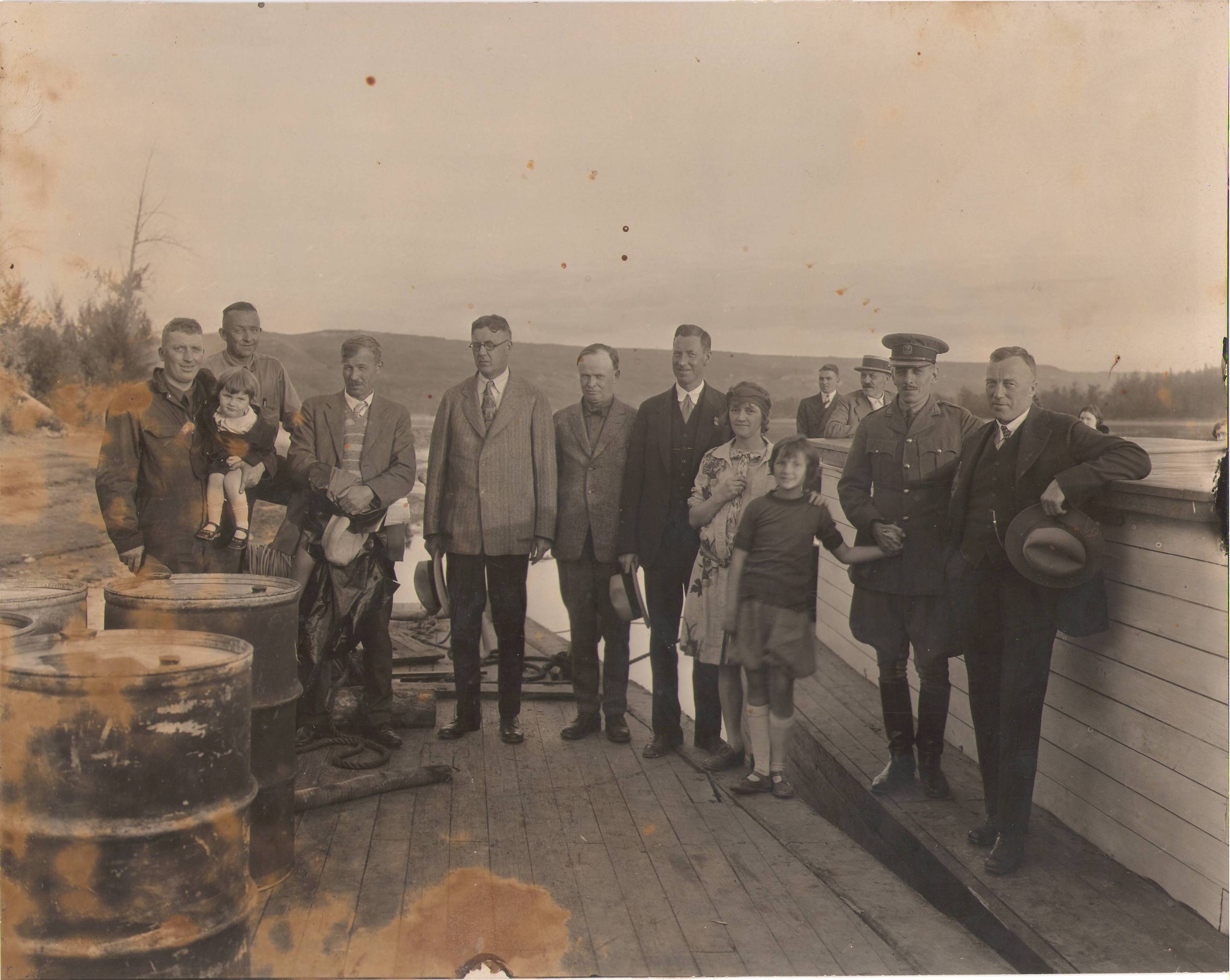 This week we have a large group of unknown individuals. They appear to be on the deck of a ship, and, noting the hills in the back, are likely closer to Peace River. We can identify the gentleman in glasses as Premier Brownlee who toured this northern area in 1929. If you recognize any of the others please let us know!
995.25.1 / Heritage Committee FVAS