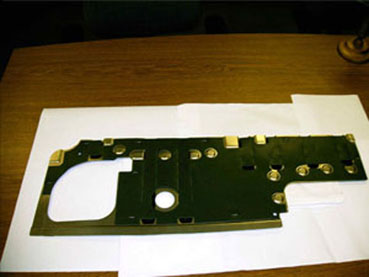 Dual Stapler Machine 
Plastic mat is stapled to blank - 4 by front stapler, 5 by rear stapler.