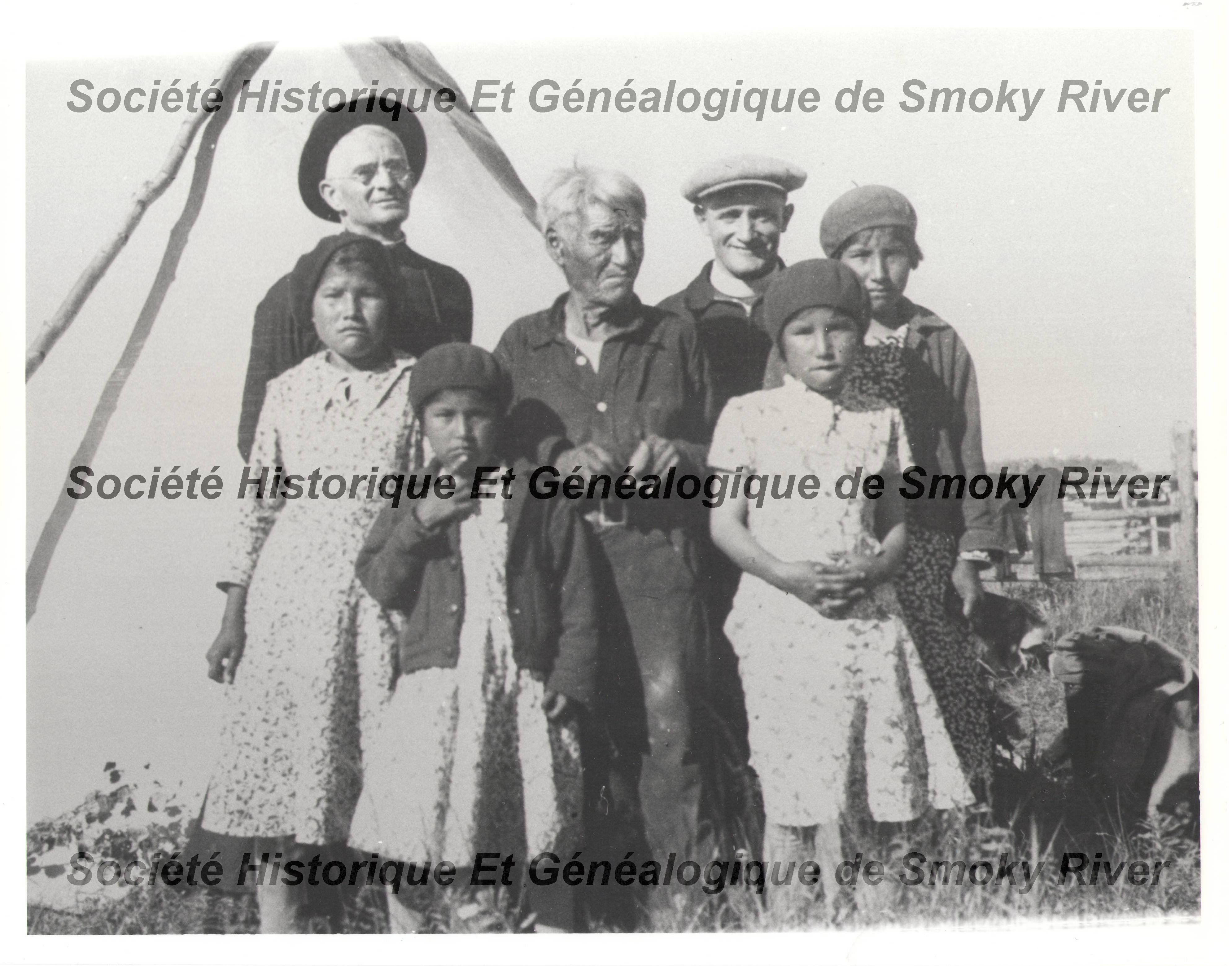 This is a photo of Father Habay (Back row left) and Father Jungbluth (Back row right) with an unknown family. Both priests worked and travelled throughout much of Northern AB, BC and sometime the territories. Let us know if you recognize these family members!
2006.01.411 / Societe Historique et Genealogique de Smoky River