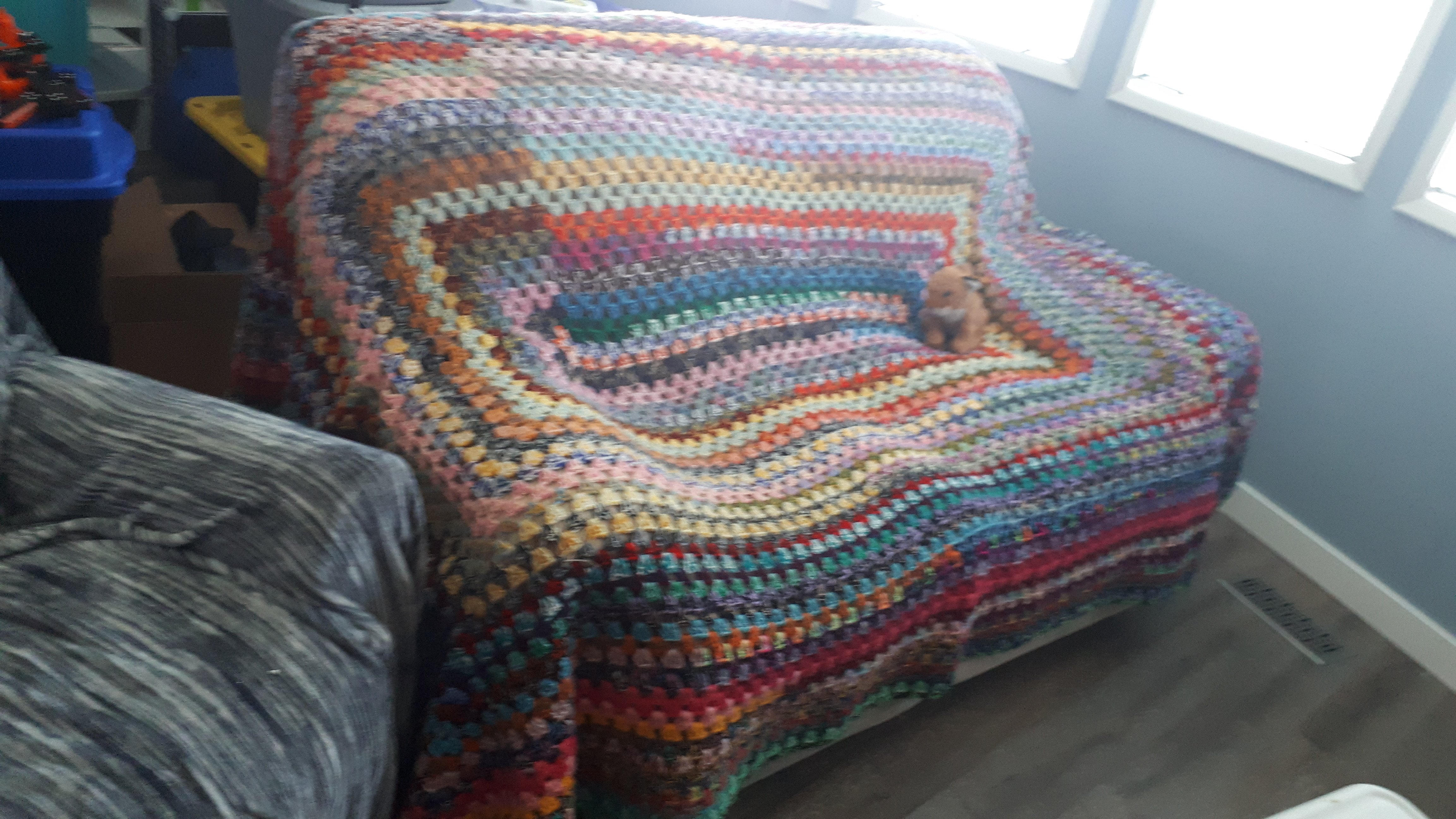 A granny rectangle blanket for the couch. 2 strand acrylic yarn randomly paired by Karen Richardson.