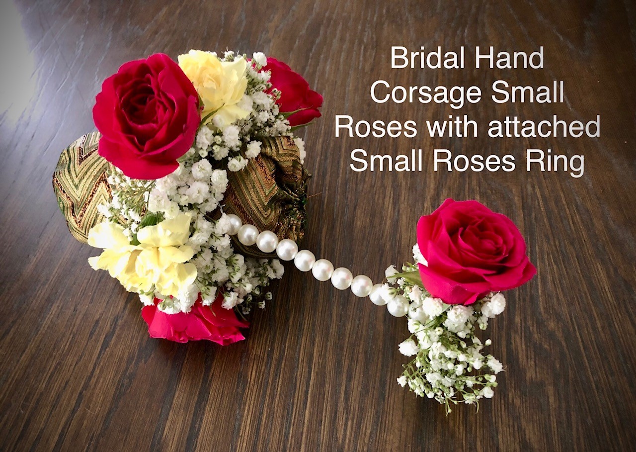 Bridal hand corsage small roses with attached ring  $65 