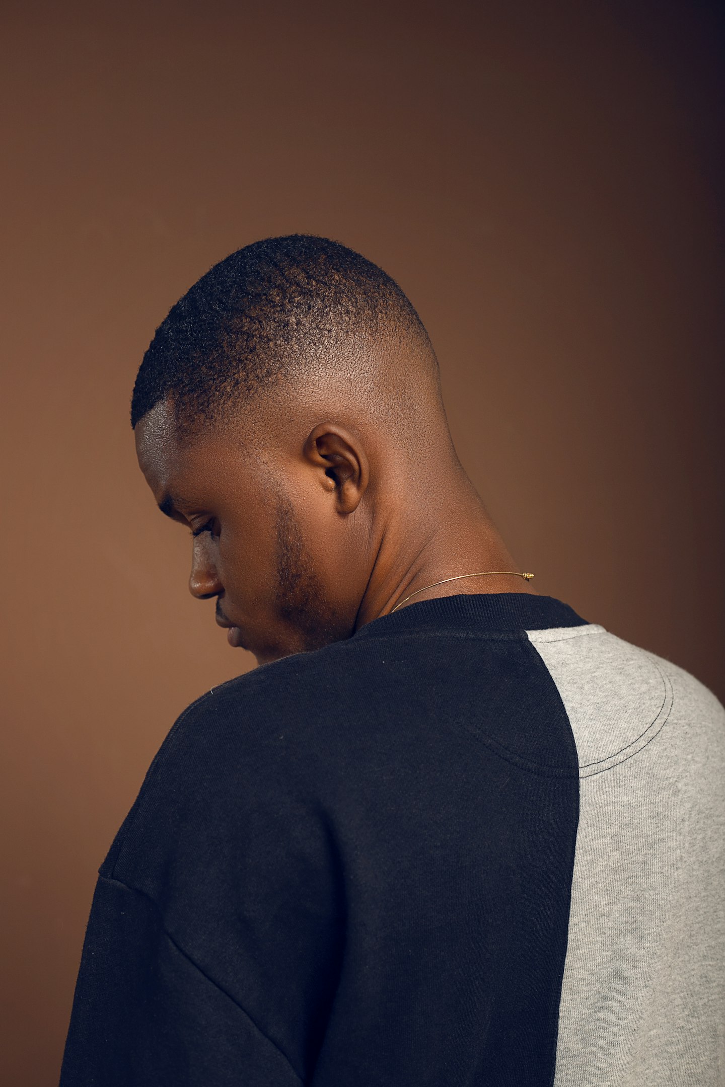 a man with a bald head and a black shirt