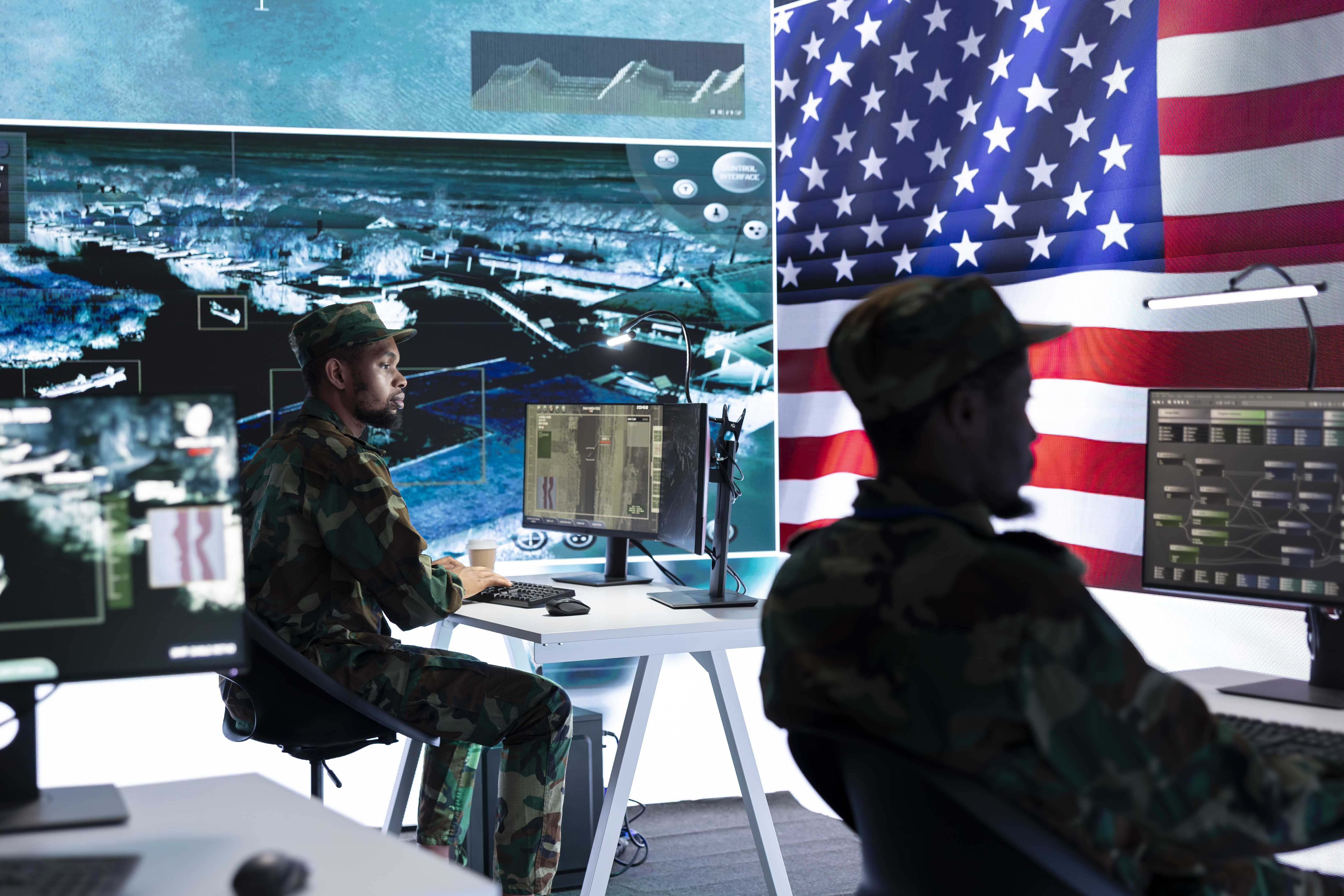 Military men working on computers