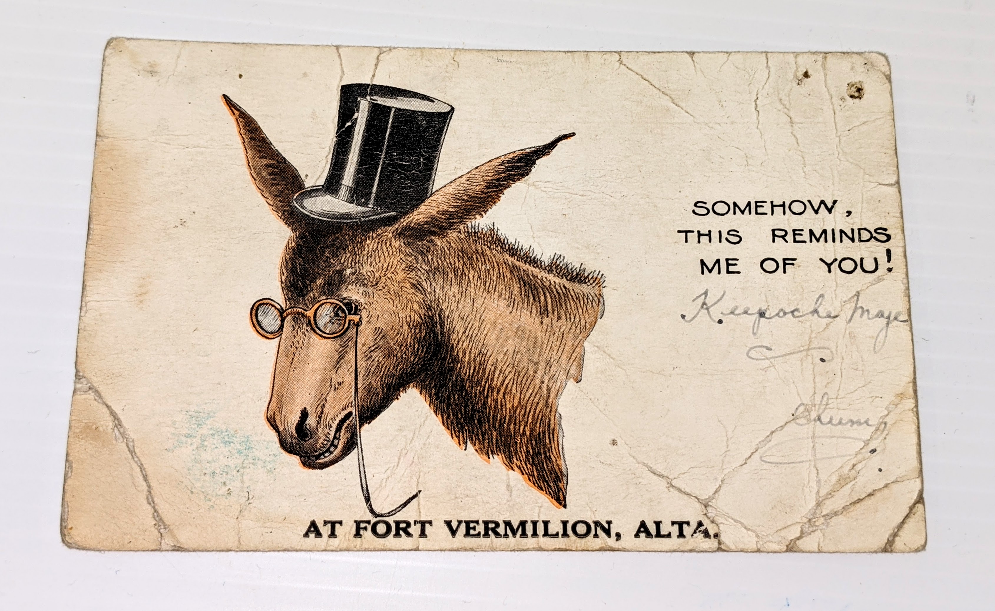 This is a postcard for Fort Vermilion from 1934. Made in the United States, the brand is "Donkey Comics" and who made generic postcards that any town or locale could add their title too. Considering the age of the post card the Board of Trade likely put the "At Fort Vermilion" stamp on it. The card is not signed nor has been sent. You'll notice on the right hand side a few words in cursive - we can't quite understand them so if you can please let us know!

16/08/2021
2001.17.01 / Mcleod, William A.