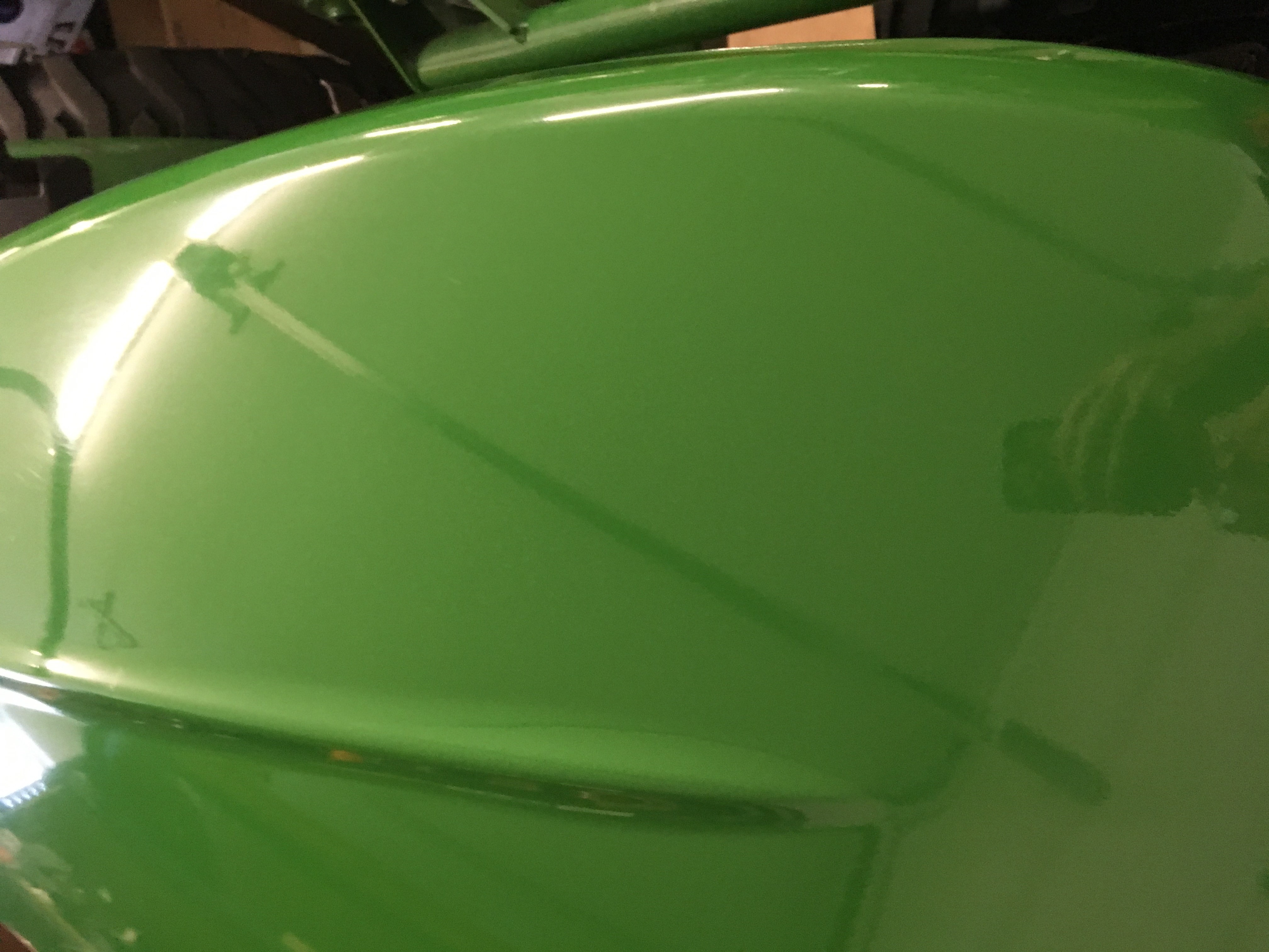 John Deere hood after using White Diamond Metal Polish