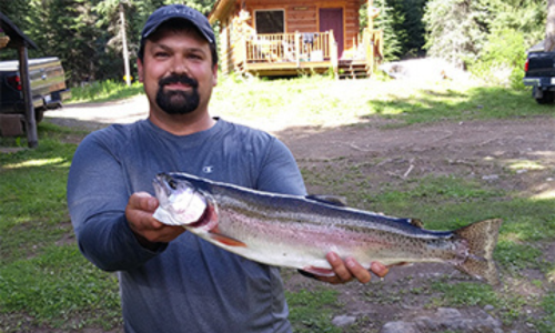 Man in Grey Shirt with His Catch