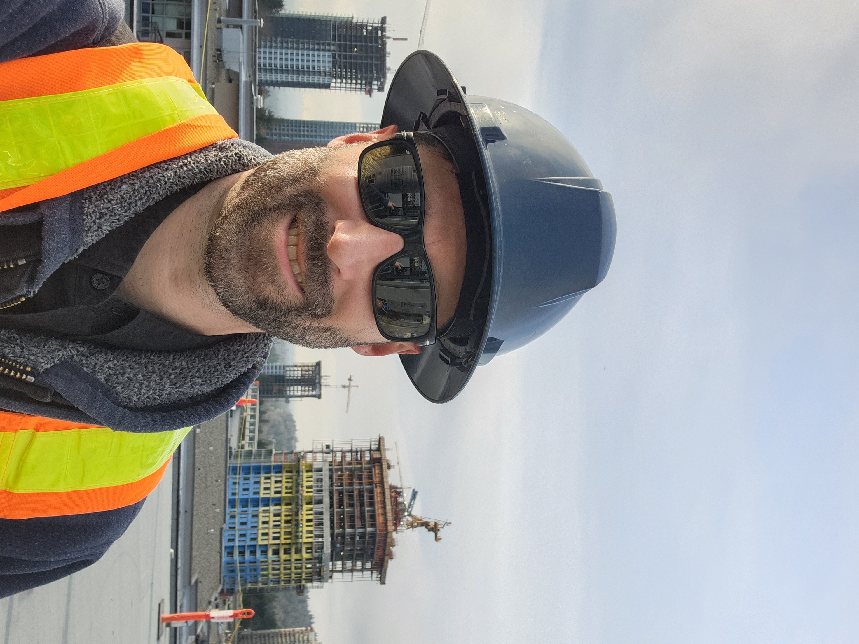 a woman in a black leather jacket looking at the camera