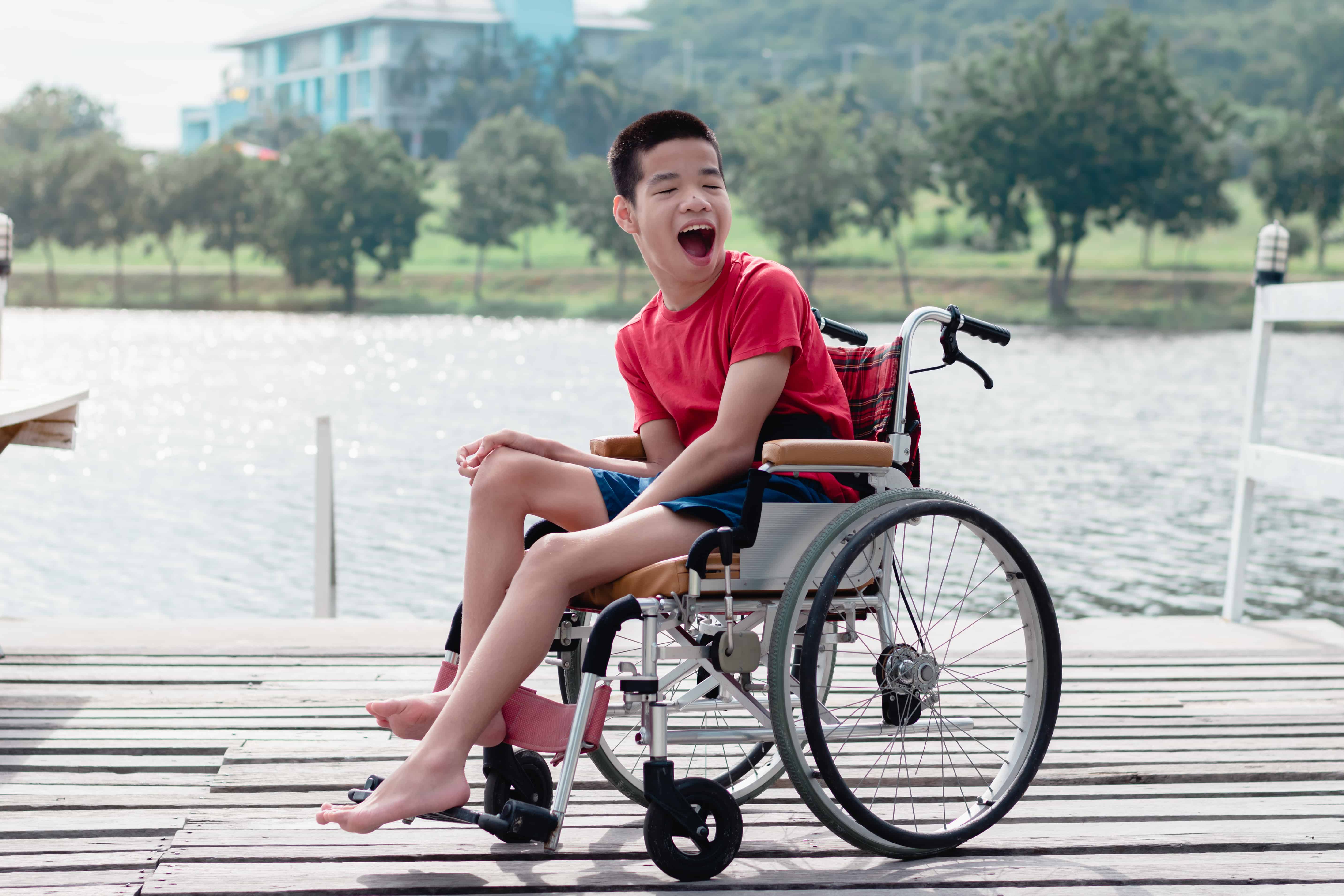 Close-up of two people holding hands, symbolizing support and empathy.