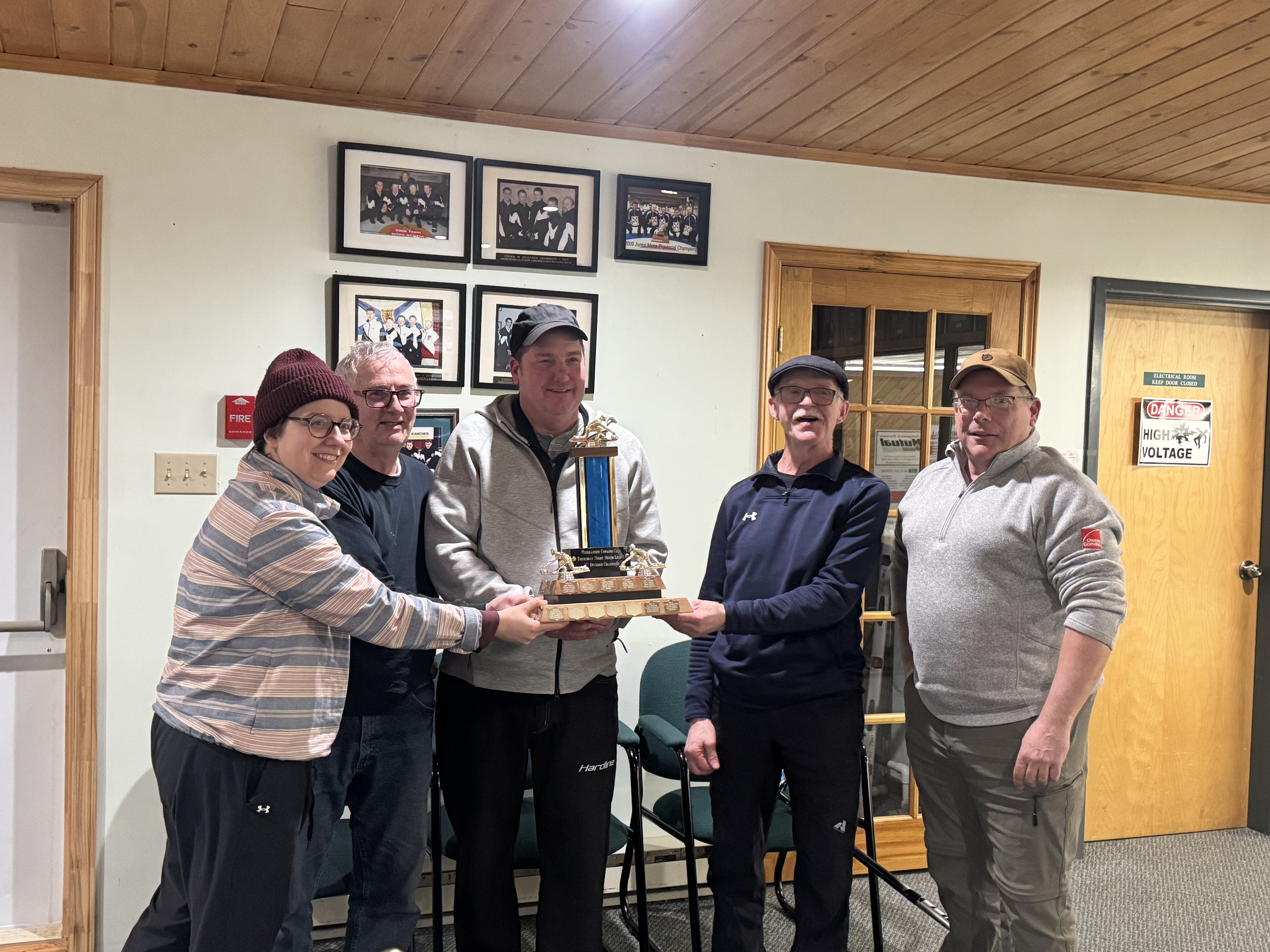 C Division Playoff Champions L-R: Laurenn McCoy (lead), James Matheson (second), Eric Lumsden (mate), and Claude Glenn (sparing for Peter vandenHeuvel). Presented by Jim Marlow - last year's recipient.