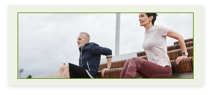 A senior man and woman working out 