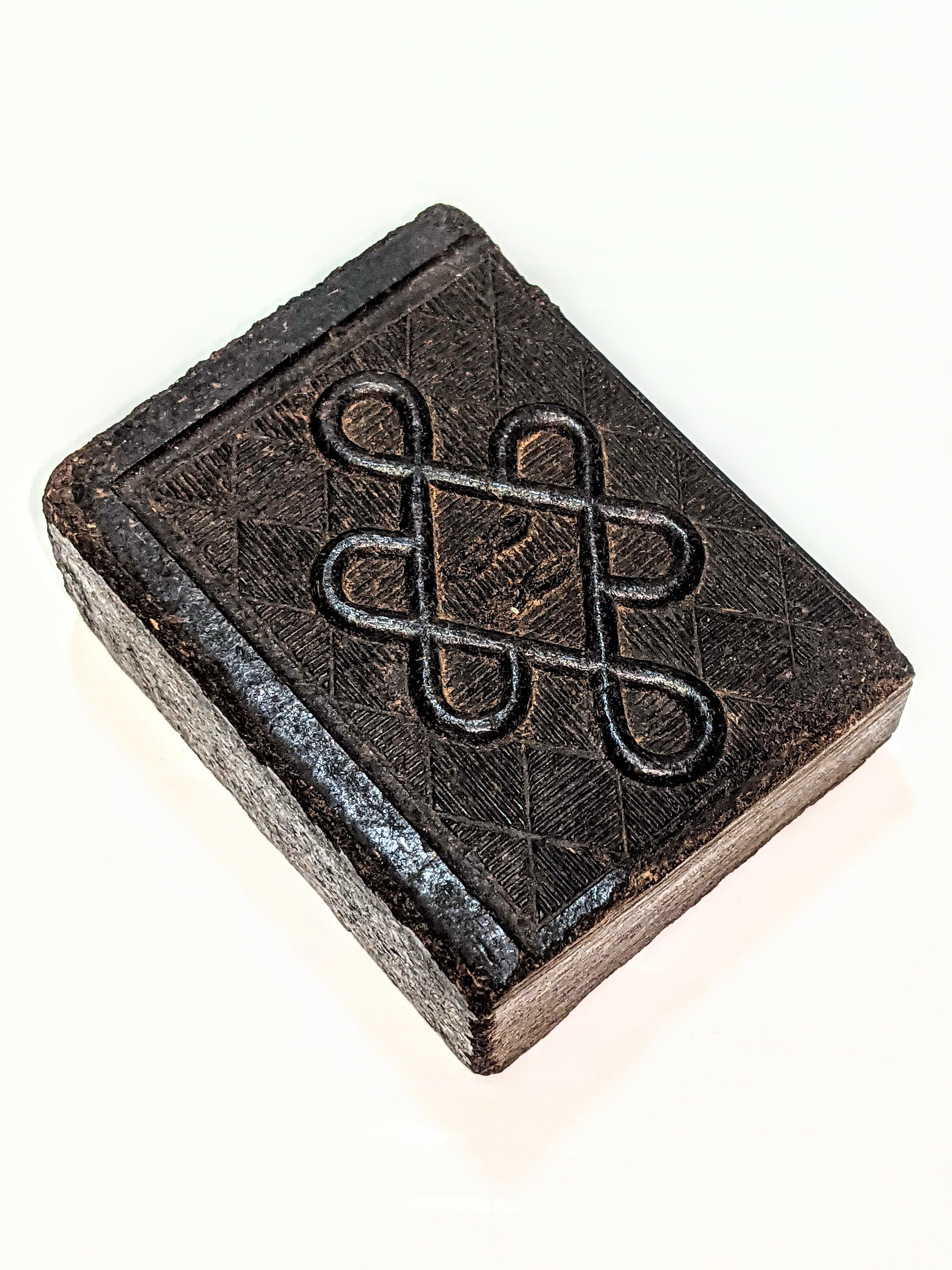 This is a black tea brick. Made of finely ground tea leaves and a binding agent (historically blood, flour, or animal dung) these molded bricks made transporting tea much easier and less likely to spoil. These characteristics made tea bricks ideal for voyagers covering long distances through North America on their Fur trade routes. Tea bricks of this nature were also used as currency in Asia and could be cut into small portions for smaller change. One would scrape about 10 grams off this brick into a litre of hot water - allowing it to steep before consuming - this brick could make about 6 litres of tea. May 21 is international Tea Day.
2006.57.1.2 / Friesen, Joy
15/05/2023