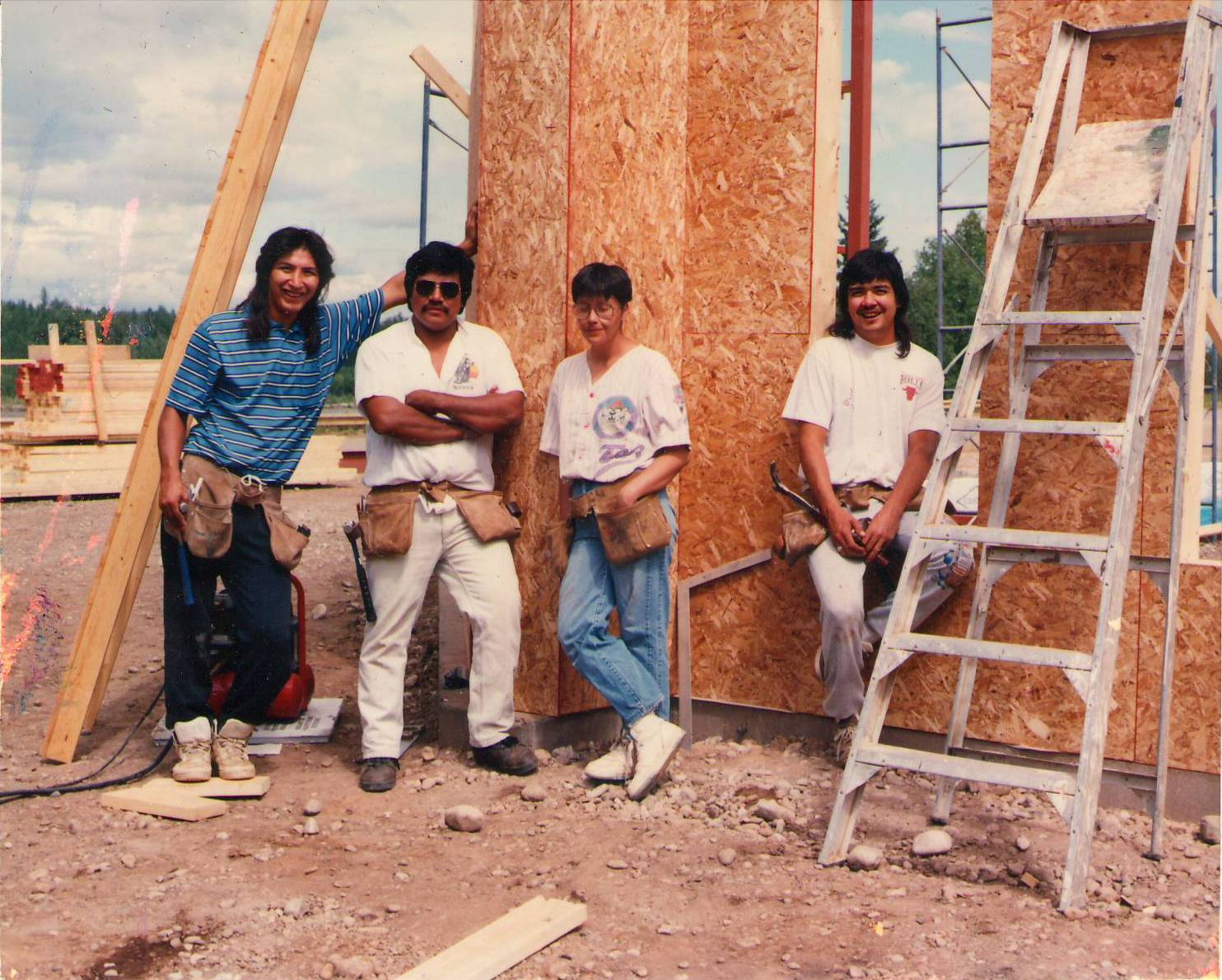 Does anyone recognize this construction crew? The've got their tool belts on and are mid construction of the Fort Vermilion Library in 1994. The construction of a library was one of the requested projects by the community to the Bicentennial committee in 1988. Thanks largely to Pearl Newman (among others) and their persistence - the library opened in 1995. Let us know if you recognize these tool (and mullet) bearers!
2008.23.150 / Goldsmith, Claire.
--EDIT--
(L-R) Gary Moberly, Malcolm Mitchell, Norma Mitchell, Nelson Judd.