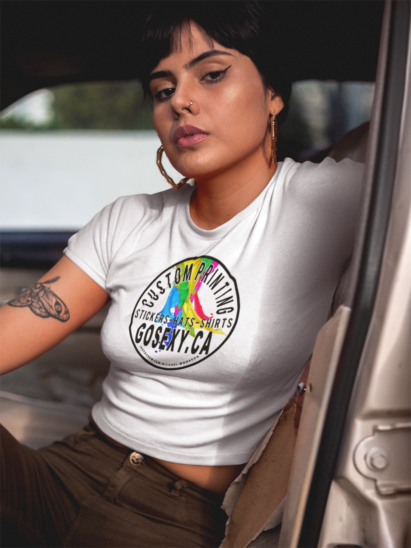 https://0901.nccdn.net/4_2/000/000/08b/587/woman-wearing-a-t-shirt-sitting-on-a-car-s-driver-s-seat-a-gosex.png